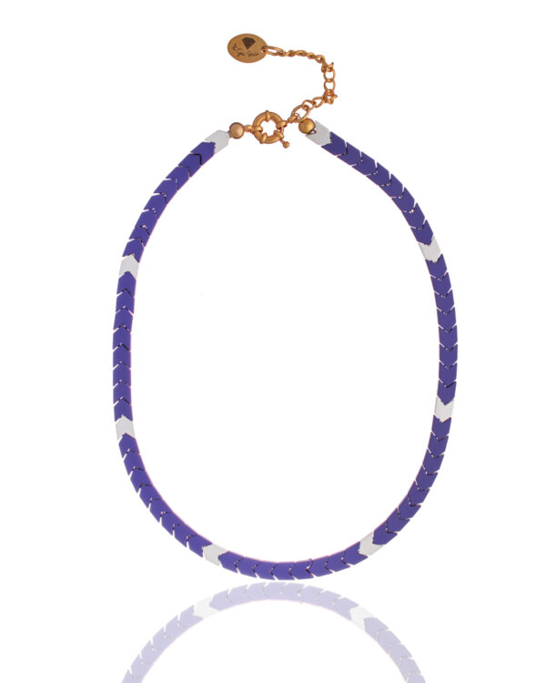Close-up of a purple and white arrow hematite necklace with gold accents and a gold chain