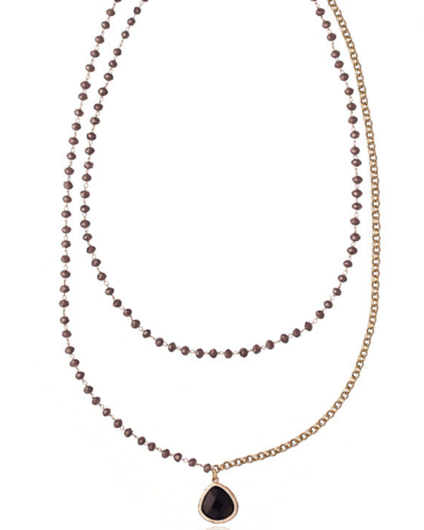 Luxurious Rosario necklace featuring a prominent crystal pendant.