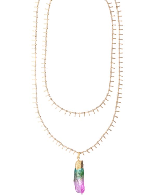 Close-up of a double chain necklace with a vibrant tourmaline pendant