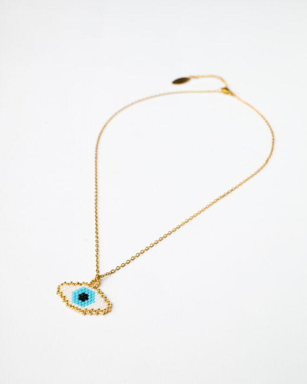 Gold chain necklace with a Miyuki beaded oval eye pendant by The Gem Stories.