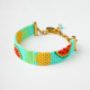 Miyuki Loom Bracelet featuring watermelon and pineapple patterns with gold clasp.