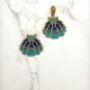 Miyuki beadwork shell pendants in blue, turquoise, and gold hues.