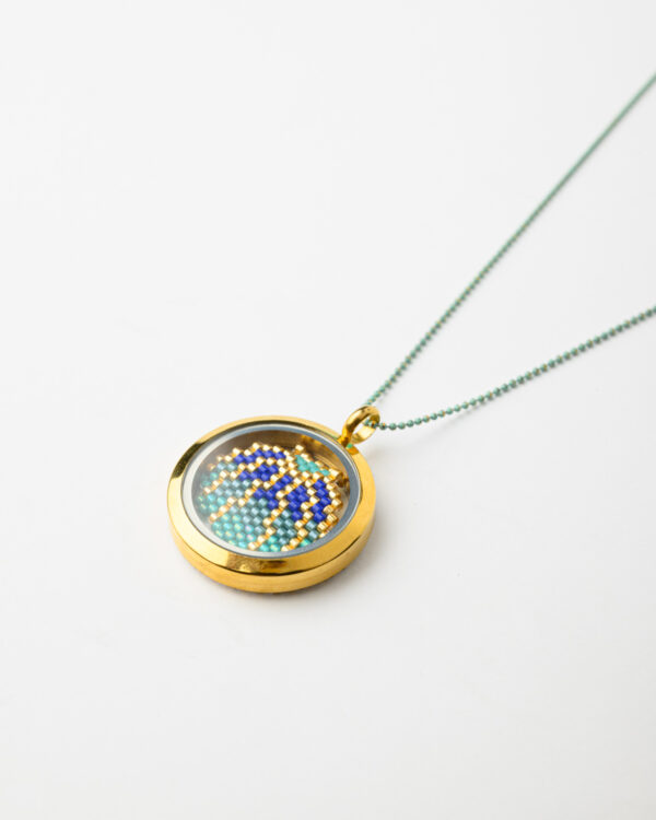 Close-up of Memory Locket Pendant with Miyuki Shell Element by The Gem Stories