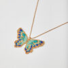 Handmade butterfly necklace with Miyuki beads in turquoise, blue, and gold.