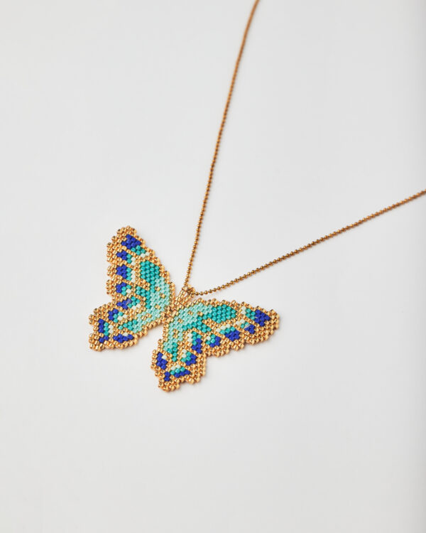 Handmade butterfly necklace with Miyuki beads in turquoise, blue, and gold.