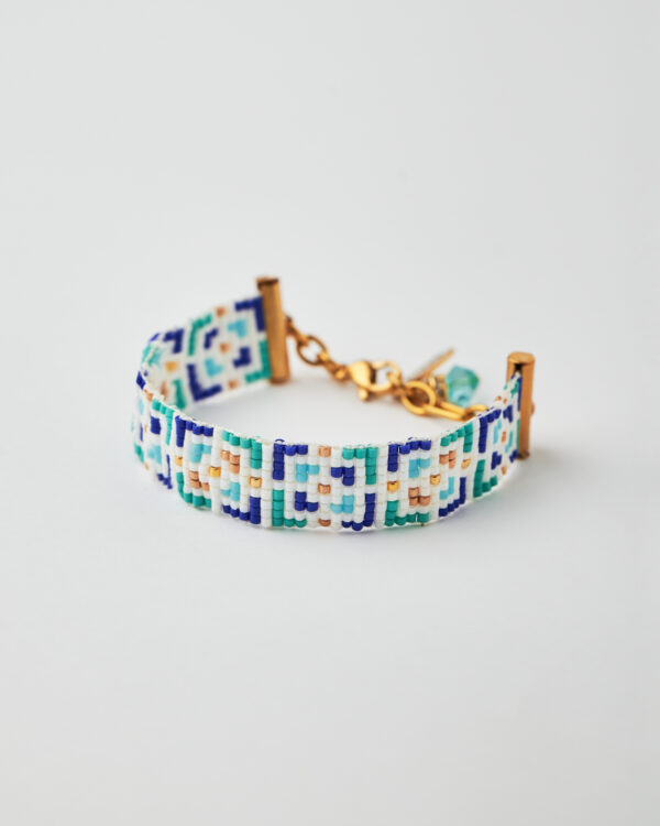 Handmade Miyuki loom-stitched bracelet with blue, green, white, and gold mosaic design.