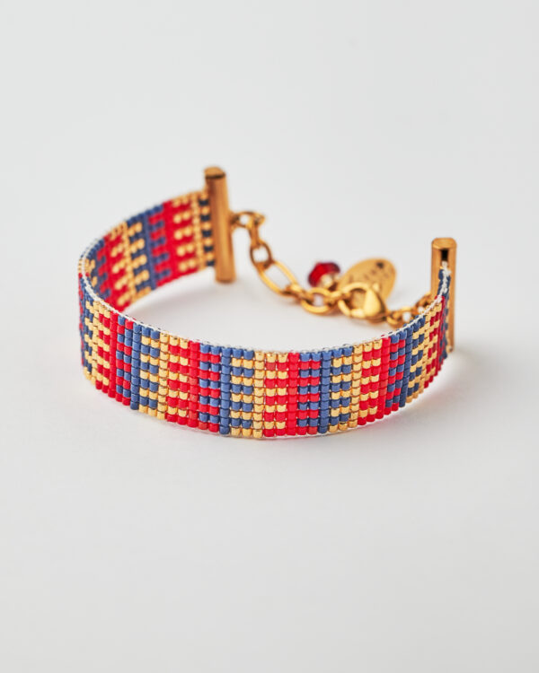 Handmade Miyuki loom-stitched bracelet with red, blue, and gold striped design.