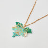 Handmade leaf necklace with Miyuki beads in green, turquoise, white, and gold.