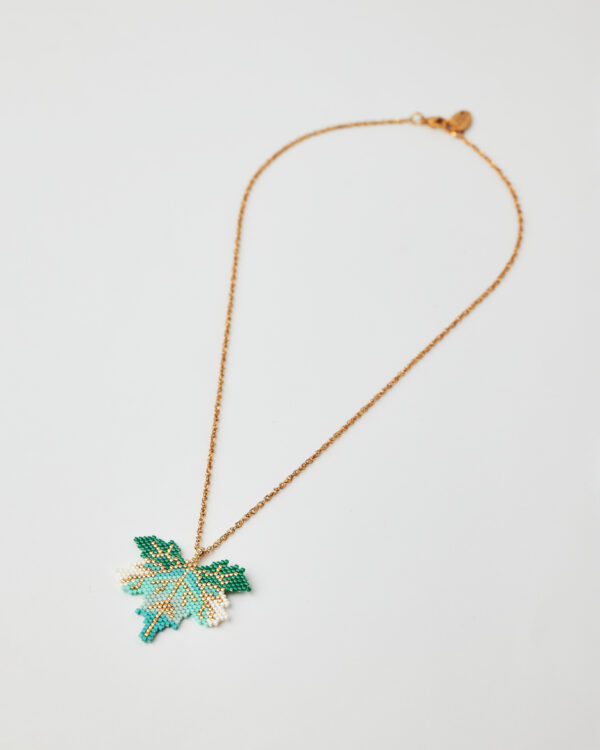 Intricate Miyuki bead leaf necklace in shades of green, turquoise, white, and gold.