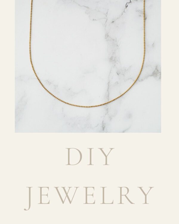 Long chain necklace featuring elegant dots crafted from 24k gold, showcasing a luxurious design.