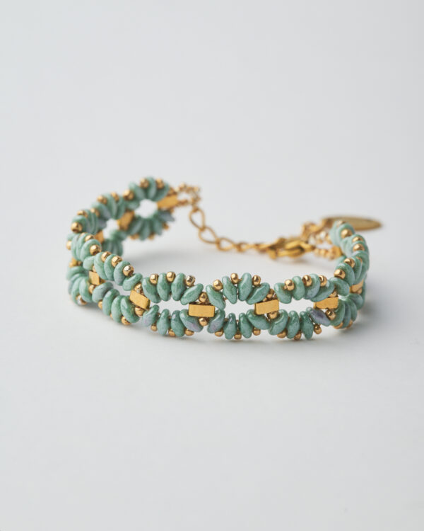 Handmade bracelet with pale blue Miyuki SuperDuo beads and gold accents.