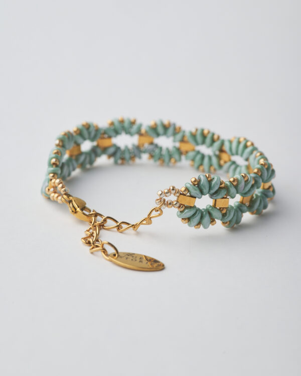 Pale blue beaded bracelet with gold details, handcrafted with Miyuki SuperDuo beads.