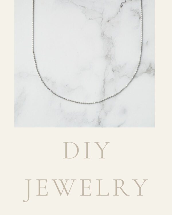 Long chain necklace with elegant rhodium-plated dots, showcasing a modern and sophisticated design.