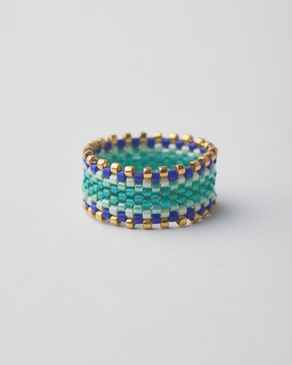 eaded ring with turquoise, blue, white Miyuki beads and gold details, ocean wave design.