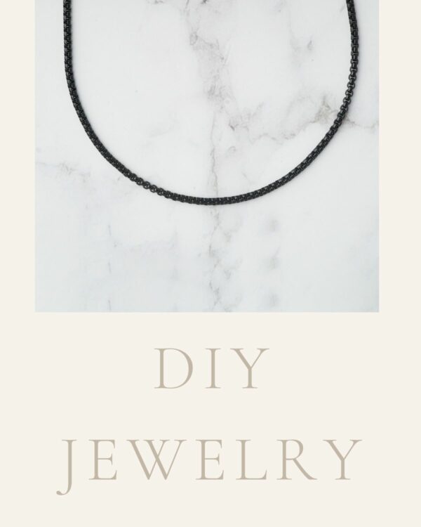 Midnight black box link chain displayed on a marble background for DIY jewelry projects.