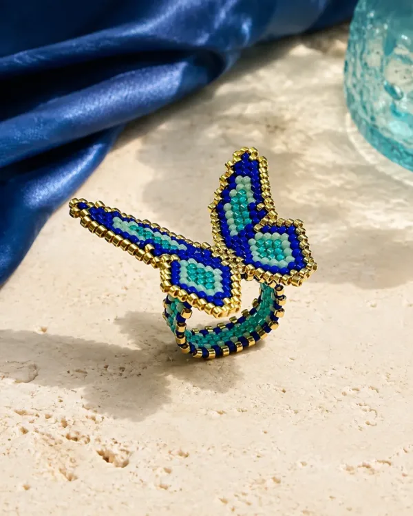 Handcrafted Miyuki butterfly ring with blue, green, and gold beads