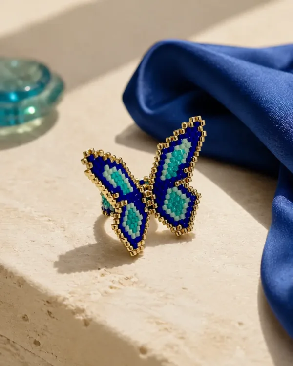 Handcrafted Miyuki butterfly ring with blue, green, and gold beads