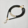 Handmade multilayer necklace with black onyx, white marble beads and gold-plated marble pendant