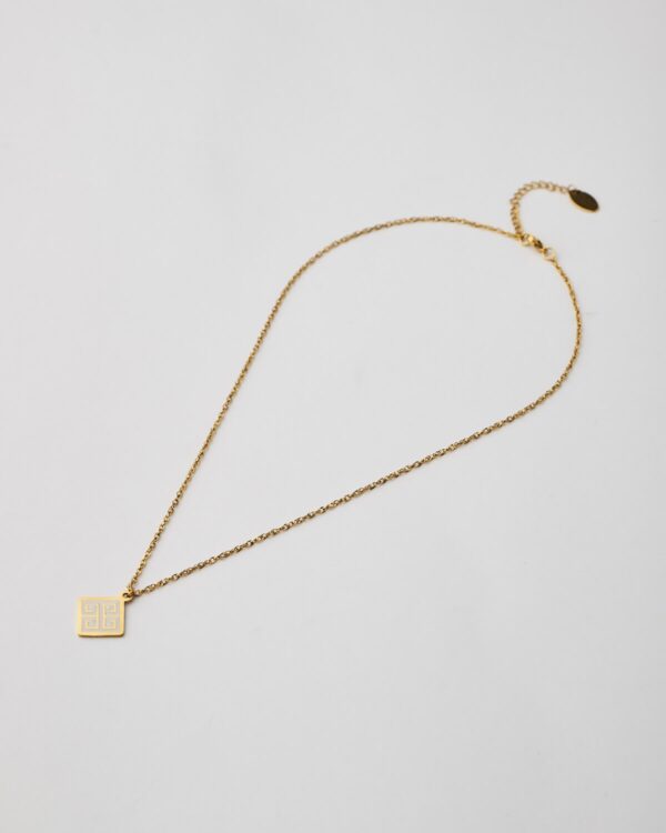 Full view of minimal gold-plated pendant necklace with geometric design