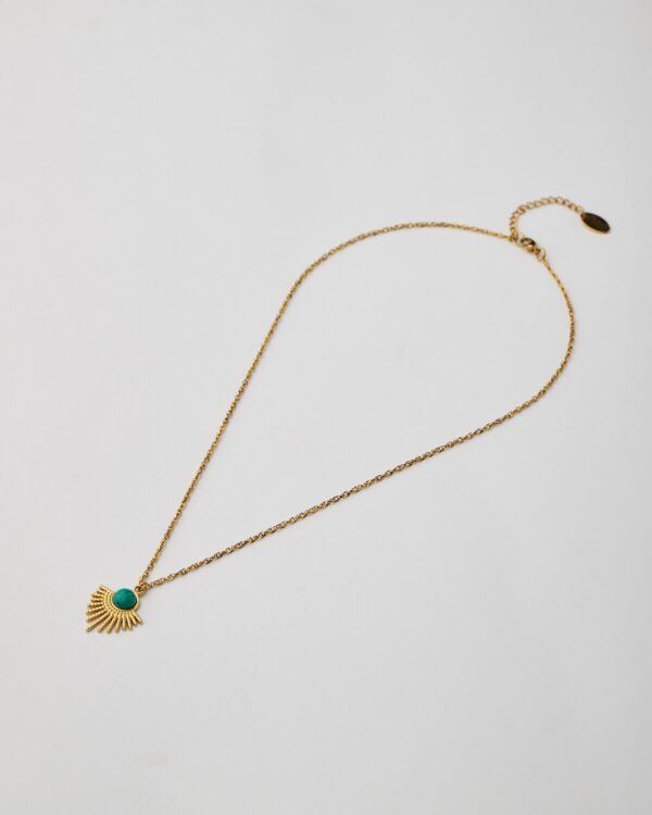 Gold sunburst necklace with turquoise howlite stone