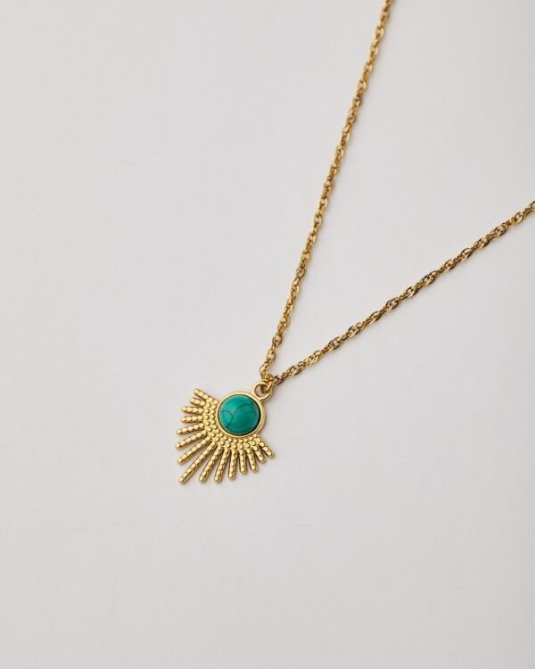 Gold sunburst necklace with turquoise howlite stone