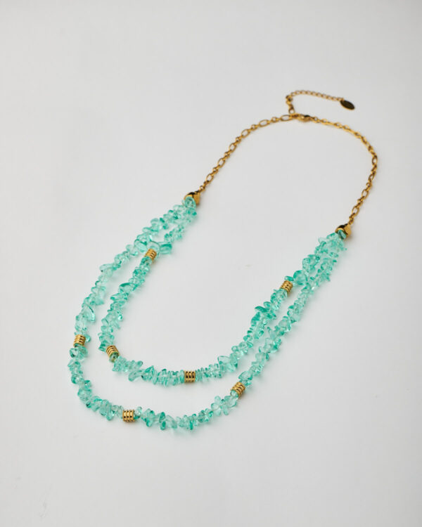 Full view of handmade double-strand necklace with aqua crystal chips and gold elements