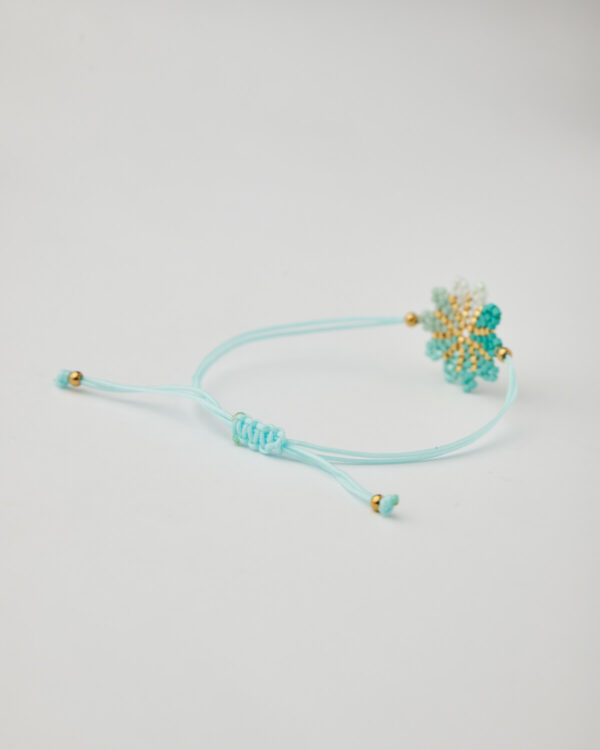 Adjustable sky-blue macrame bracelet with a central flower made of Miyuki beads