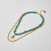 Handmade layered necklace with marble aquamarine howlite beads and sunburst gold pendant