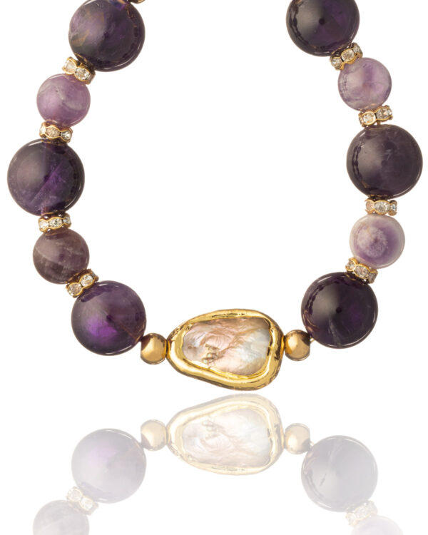 Close-up of amethyst beads and baroque pearl