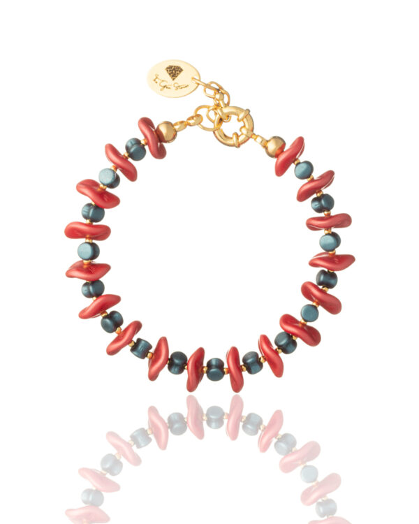 Coral and blue ripple beads bracelet on a white background