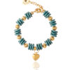 Pastel emerald bracelet with ripple beads, gold accents, and a heart charm on a white background