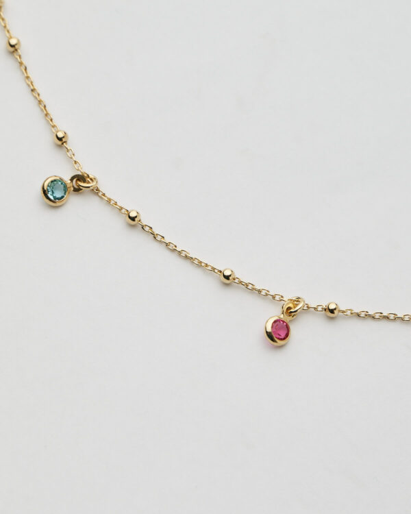 Long gold chain necklace with multicolor gemstone charms by The Gem Stories