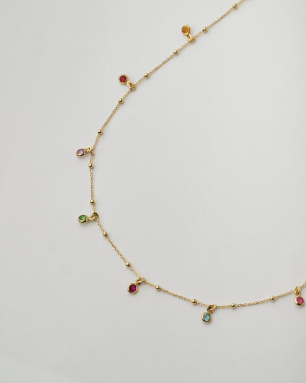 Long gold chain necklace with multicolor gemstone charms by The Gem Stories