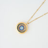A handmade memory locket necklace featuring a blue evil eye design crafted from Miyuki beads. A protective symbol of harmony and light.