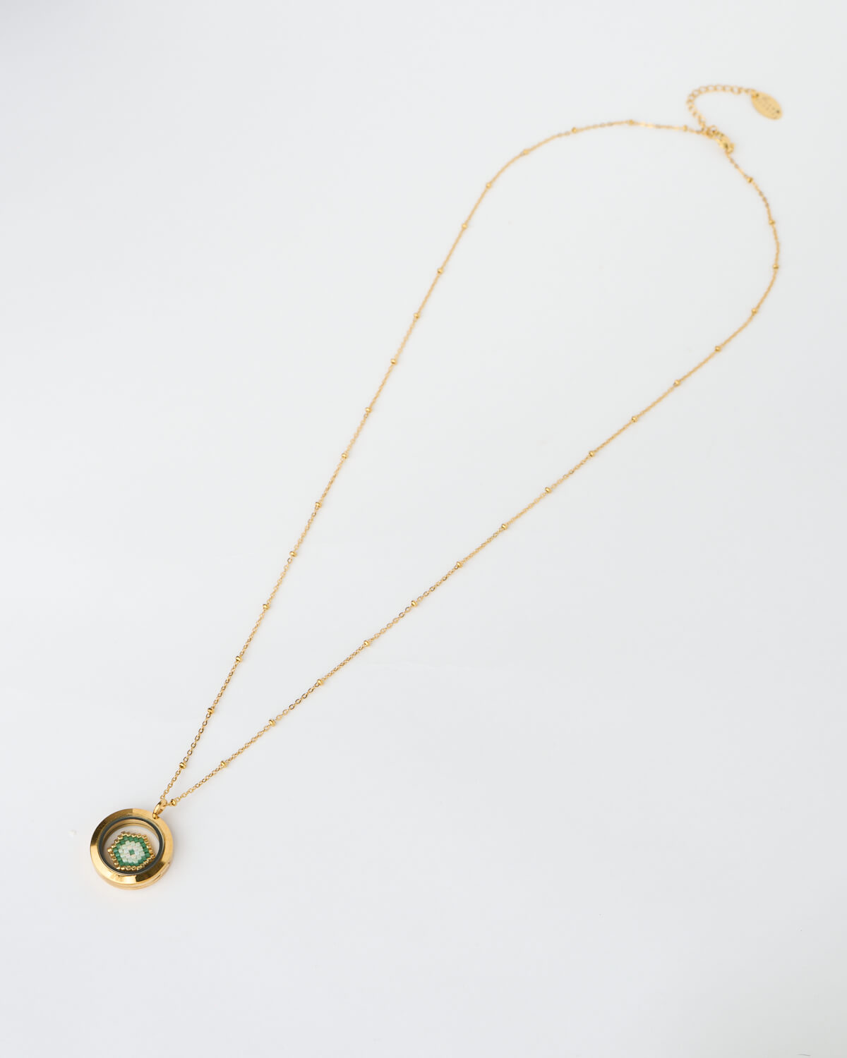 Golden Green Evil Eye Miyuki Memory Locket Necklace Golden Green Evil Eye Miyuki Memory Locket Necklace by The Gem Stories