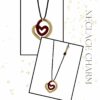 Red Heart Necklace Charm by The Gem Stories – handmade gold and red enamel heart pendant symbolizing love and passion.