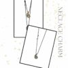 Silver Drop Necklace Charm by The Gem Stories – handmade polished silver pendant on black cord.
