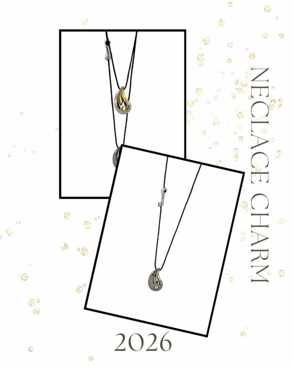 Silver Drop Necklace Charm by The Gem Stories – handmade polished silver pendant on black cord.