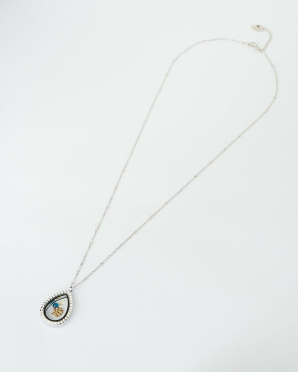 Silver teardrop memory locket necklace with blue gemstones and gold leaf charm by The Gem Stories