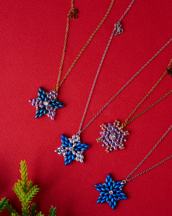 XMAS star necklace from The Gem Stories on festive red background
