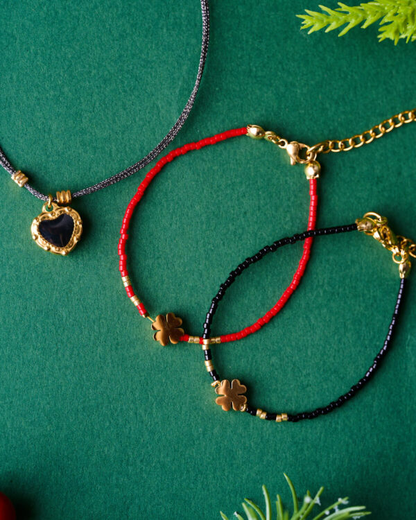 Lucky Clover Duo Bracelet with red and black beaded cords by The Gem Stories