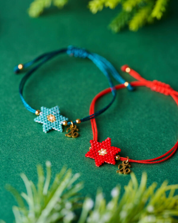 Close-up of Miyuki New Year 26 Star Bracelets in turquoise and red by The Gem Stories.