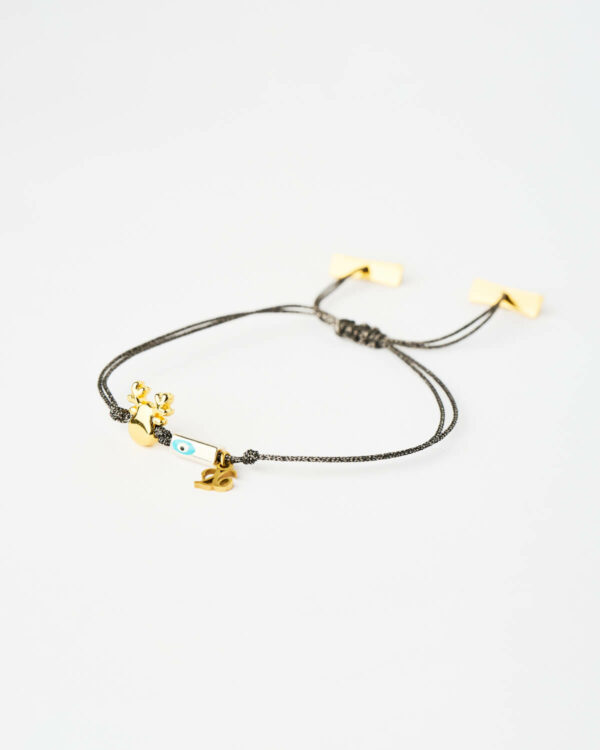 Reindeer Evil Eye Bracelet in black cord with gold reindeer charm and turquoise evil eye by The Gem Stories