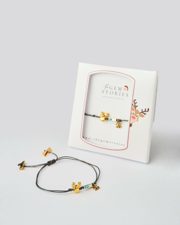 Reindeer Evil Eye Bracelet in black with gold charms shown in gift box by The Gem Stories
