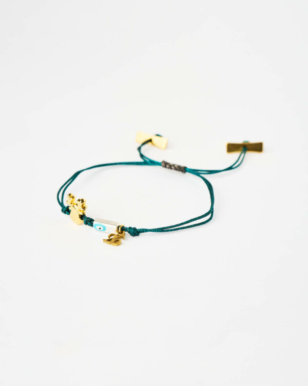 Reindeer Evil Eye Bracelet in blue cord with gold reindeer charm and turquoise evil eye bead by The Gem Stories