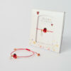 Handmade Miyuki bracelet with red ladybug charm in gold details