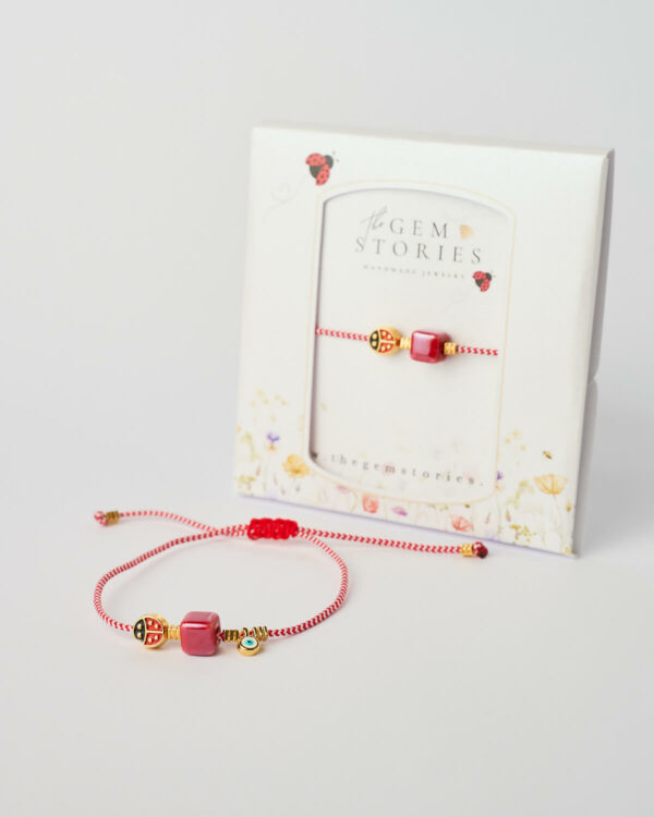 March macrame lucky charm bracelet with red cube, evil eye and ladybug