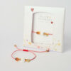 March macrame lucky charm bracelet with white cube, evil eye and ladybug