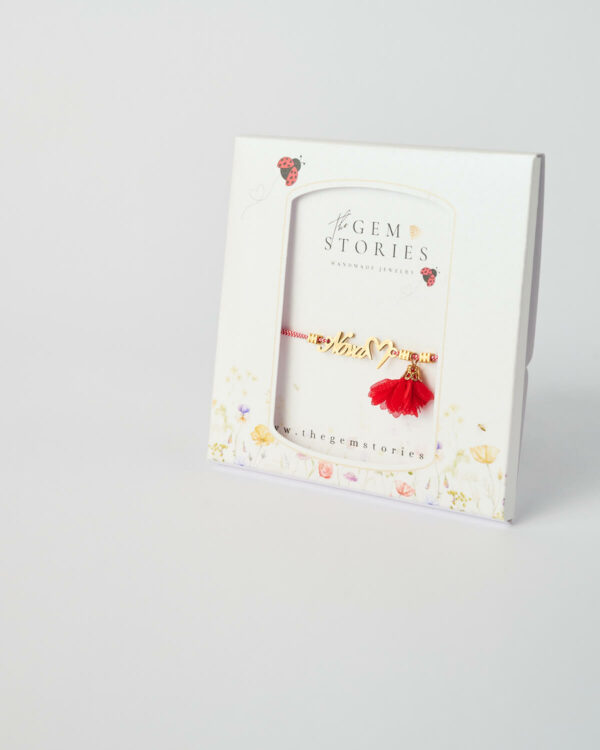 Nona Love Martaki red bracelet with symbolic charm by The Gem Stories