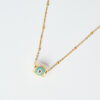 Κοντινή λήψη του κολιέ Miyuki Round Evil Eye σε απόχρωση Ice με χρυσή αλυσίδα, χειροποίητο από το The Gem Stories